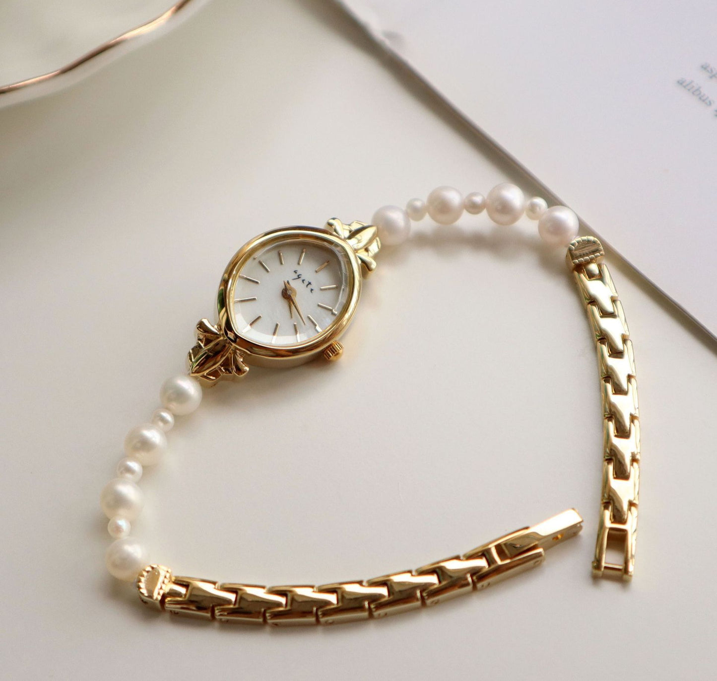 Montre à quartz pour femme, bracelet en perles d'eau douce naturelles